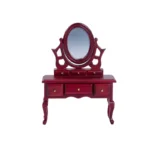 Miniature dollhouse vanity table in rich mahogany red featuring a decorative oval tilting mirror, six drawers with brass knobs, and elegant curved cabriole legs in Victorian style.