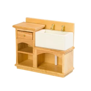 Country style pine wood kitchen sink unit featuring white ceramic farmhouse sink, brass taps, single drawer, and open storage shelves beneath.