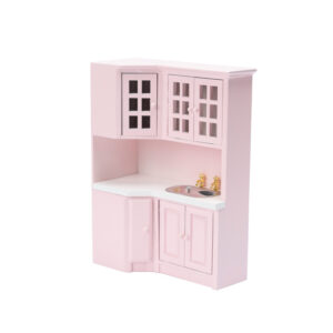 Miniature pink corner kitchen cabinet featuring white countertop, glass-paneled upper cabinets, gold faucet fixtures, and lower storage units in a charming pastel design.