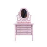 Miniature dollhouse dresser in soft pink featuring an adjustable oval mirror, four drawers with gold knobs, and delicate turned legs in Victorian style.