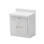 Modern white miniature kitchen cabinet featuring a raised backsplash, horizontal drawer with groove detail, and double doors with vertical slats, ideal for contemporary dollhouse designs.