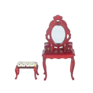 Miniature dollhouse furniture set featuring a burgundy red dressing table with ornate oval mirror, decorative carvings, curved legs, and matching stool with white polka dot fabric cushion.