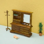 Miniature dollhouse dresser in warm walnut finish featuring an integrated mirror, display shelves, multiple drawers, cabinet storage, and decorative crown molding.