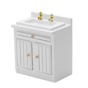 Miniature white bathroom vanity cabinet featuring a modern sink with gold-tone dual faucets, one drawer, and double doors with vertical grooves, perfect for classic dollhouse bathrooms.