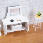 Miniature dollhouse dressing table in pure white featuring adjustable mirror, two drawers with gold knobs, two side cabinets, and curved legs in elegant classic style.