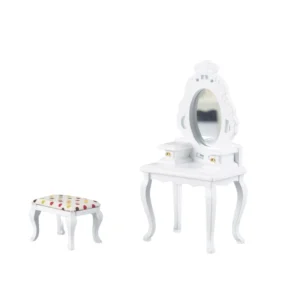 Miniature dollhouse furniture set including a white Victorian dressing table with ornate oval mirror, two drawers with gold knobs, curved legs, and matching stool with polka dot fabric cushion.