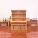 Beautifully crafted miniature hutch with shelves and drawers for dollhouse decoration.