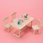 Miniature wooden dining set including one table and four chairs, perfect for dollhouse decor.