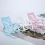 Miniature white rocking chair designed for dollhouses, perfect for crafting projects.