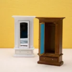 Miniature walnut wardrobe featuring a mirror and a drawer, designed for dollhouse decoration.