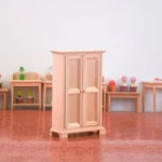 Miniature wooden cabinet with double doors and a stylish design, perfect for dollhouse decoration and storage.