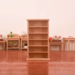 Unfinished wooden bookshelf designed for dollhouses, featuring five spacious open shelves for displaying items.