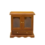 1:12 scale walnut-finished cabinet featuring two glass panel doors, bottom drawer with brass knobs, scalloped base, and traditional design for dollhouse display furniture.