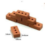 Set of 100 miniature terracotta bricks measuring 1.6cm x 0.8cm x 0.45cm, featuring single central hole design, crafted in uniform terracotta color with precise center perforation for specialized miniature construction