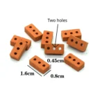 Set of 100 miniature terracotta bricks measuring 1.6cm x 0.8cm x 0.45cm, featuring two mounting holes instead of standard three, crafted in classic orange clay with precise hole placement for specialized construction needs