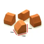 Set of 100 miniature terracotta cube blocks measuring 1.4cm on each side with distinctive sloped top surface, featuring natural clay texture and warm orange-red color, perfect for 1:12 scale architectural detailing