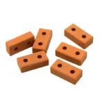 Set of 100 miniature rectangular terracotta clay blocks with two through holes, featuring a smooth matte finish and uniform dimensions of 2.8cm x 1.4cm x 0.9cm, perfect for 1:12 scale architectural models