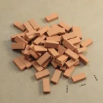 Set of 100 miniature rectangular terracotta clay blocks, featuring a smooth matte finish and uniform dimensions, perfect for 1:16 scale architectural models